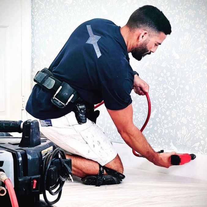 Precision Painting crew installing baseboards